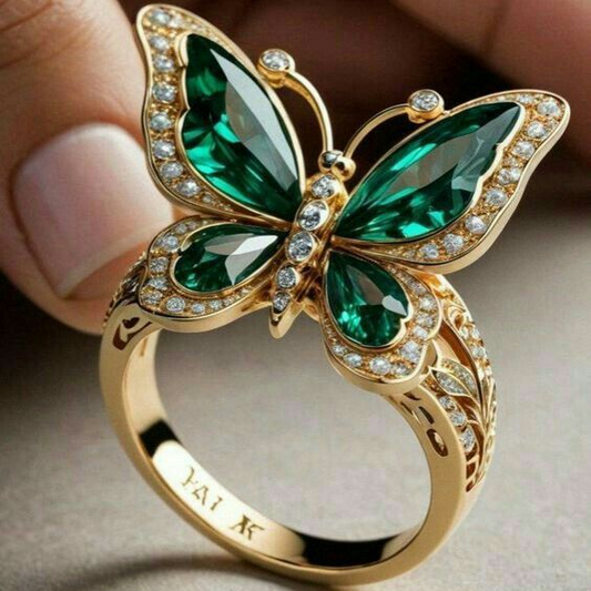 Anillo de oro con mariposa cristalina verde
